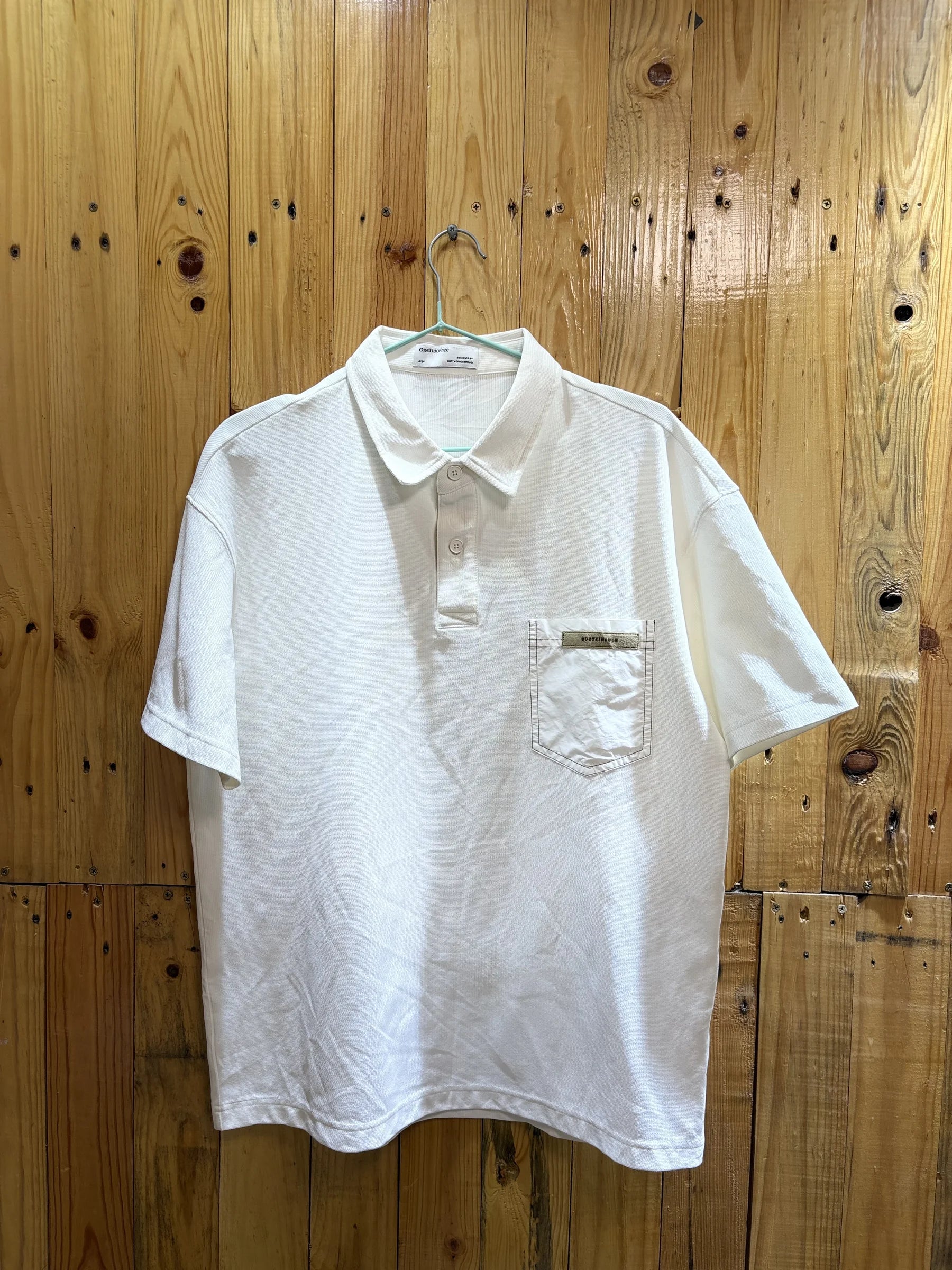 Polo blanc poche zippée