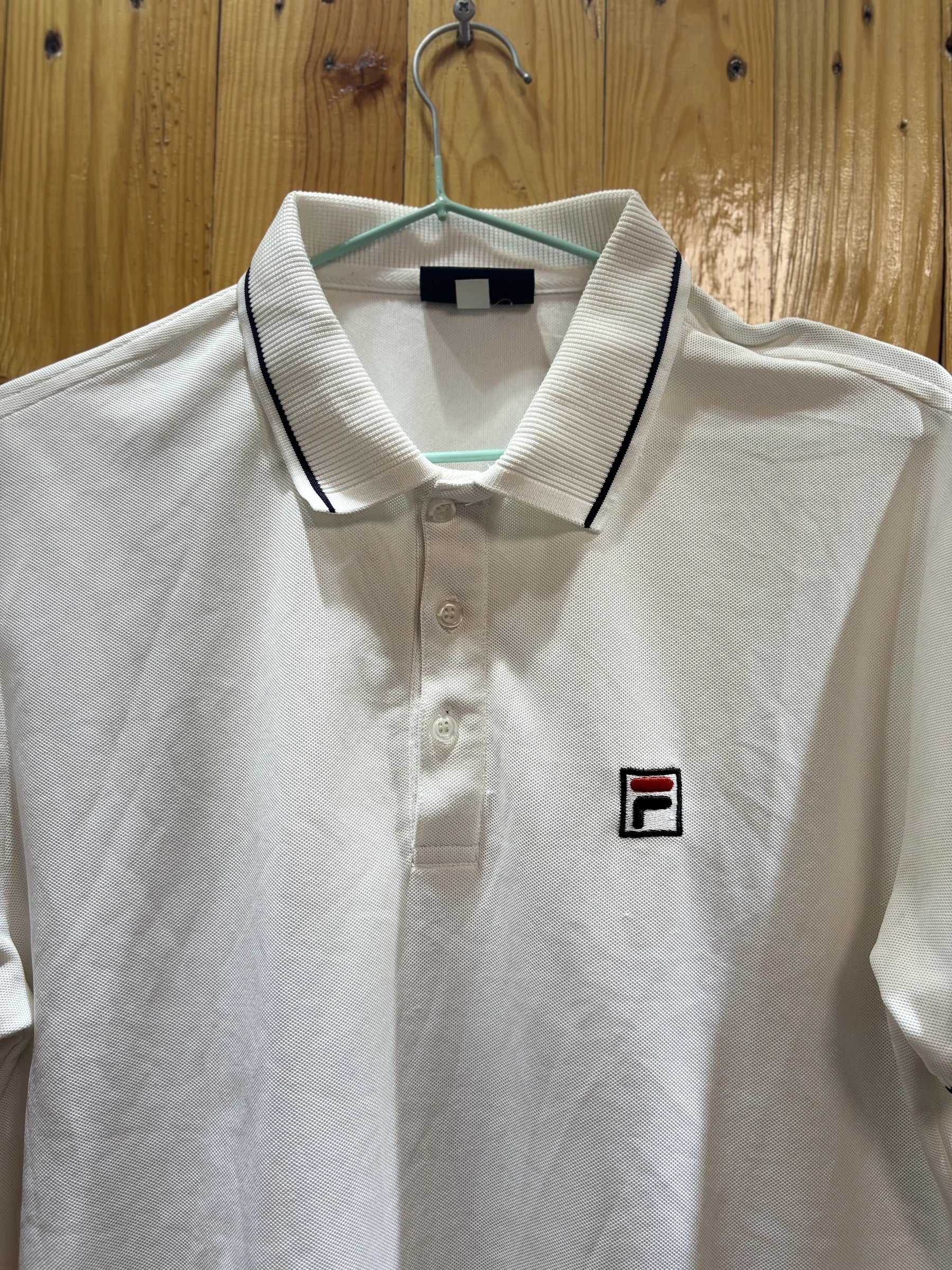 Polo blanc liseré noir