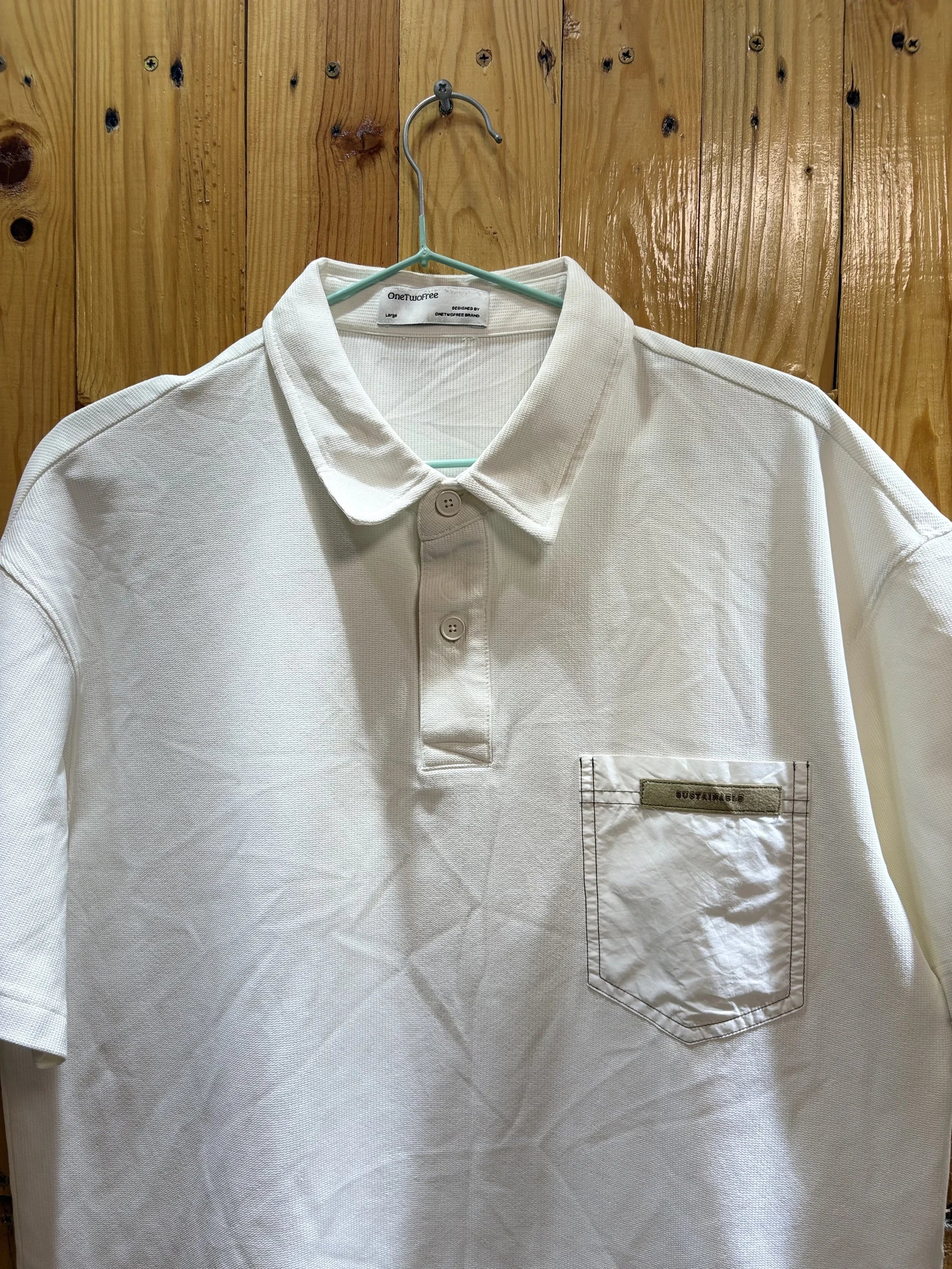 Polo blanc poche zippée